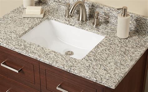 Its black granite top accents the antique style of this beautiful vanity and comes. How to Choose a Bathroom Vanity Top - The Home Depot