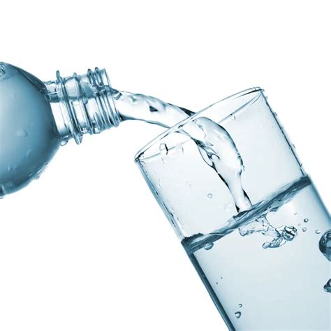 Water Pouring Into Glass From Bottle — Stock Photo © Artjazz 3004932