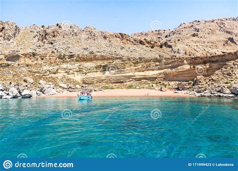 Tourist Boat Anchored By Red Sand Beach Rhodes Greece