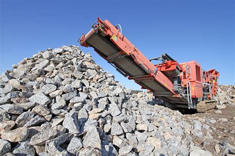 Rock Crusher Machine On A New Road Construction Site Stock Photo