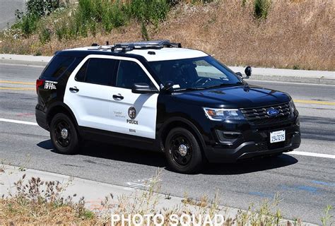 A Police Suv Is Parked On The Side Of The Road