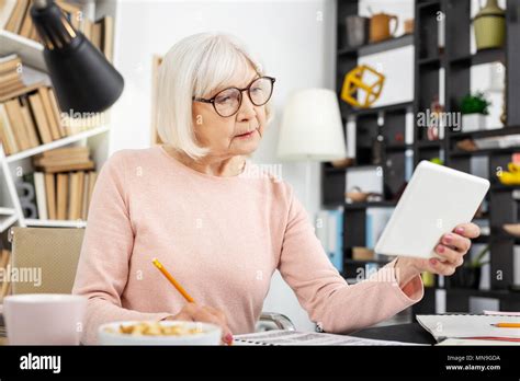 Concentrated Senior Woman Regarding Lecture Stock Photo Alamy
