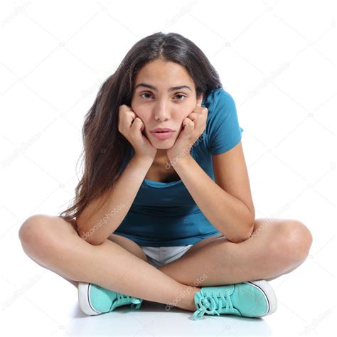 Bored Teenager Girl Sitting With Crossed Legs Stock Photo By Antonioguillemf