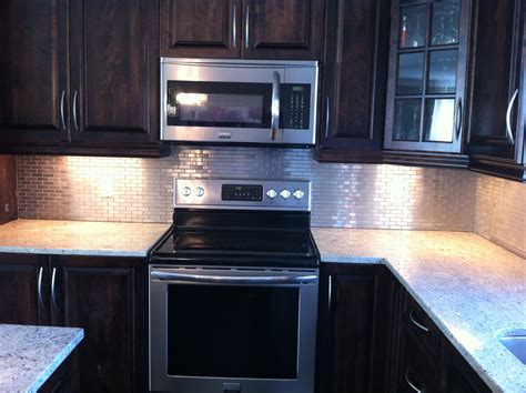 Test the placement of the sheet. Stainless Steel Backsplash installed By Stepping Stone ...