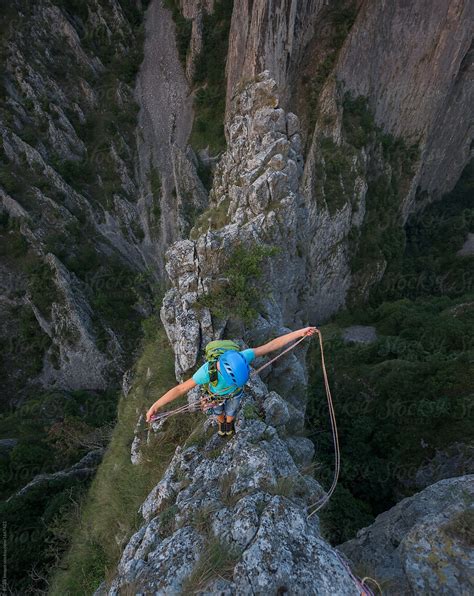 Female Rock Climber Standing On Top Of Mountain Gorges Del Colaborador De Stocksy Ibex Media