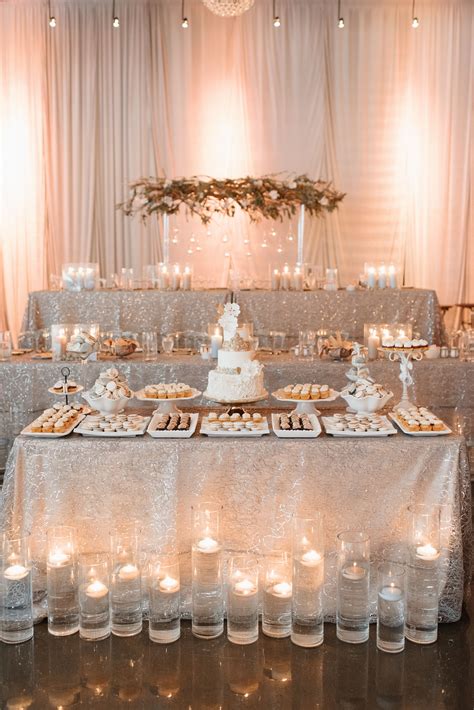 The Cake Table With This Beautiful White Cake Made By Sweet Philosophy