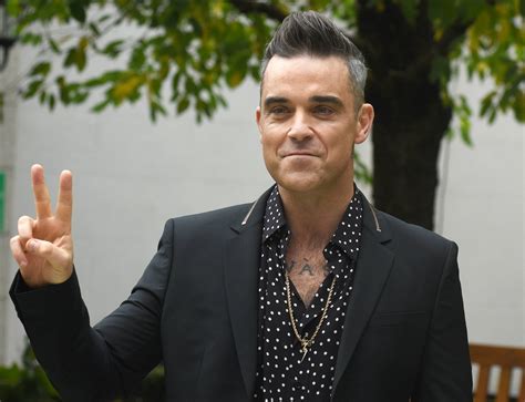 Robbie Williams May Face Fine For Obscene Gesture During World Cup