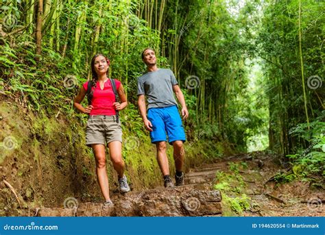 Forest Hike Hikers Hiking In Rainforest Trail In Hawaii Interracial Couple Walking In Travel