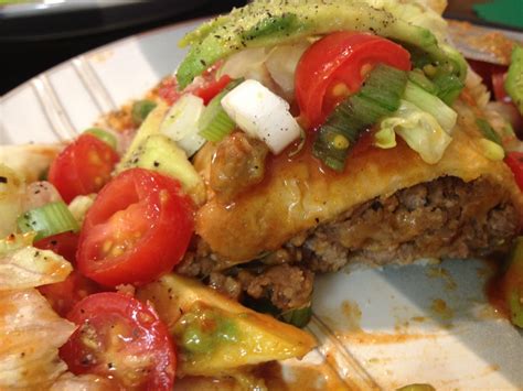 Smothered burritos are large enchiladas that are covered with red, green, or white sauce. To A Mans Heart & A Womans Thighs: Smothered Burritos