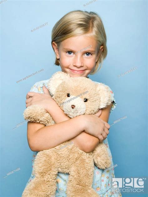 Girl Hugging Teddy Bear Stock Photo Picture And Royalty Free Image