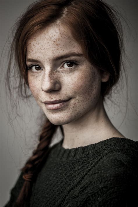 Beautiful Girl With Red Hair And Freckels And A Mona Lisa Smile