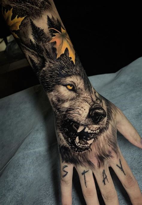 A Person S Hand With Tattoos On It And A Wolf Face Painted On The Palm