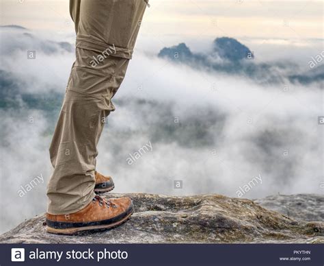 Trekking Shoe And Legs On Rocky Hiking Trail In Mountains Motivation