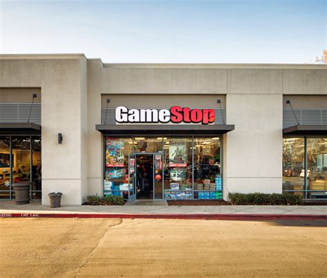 Gamestop Video Games Store Entrance Facade In Strip Mall With Sign