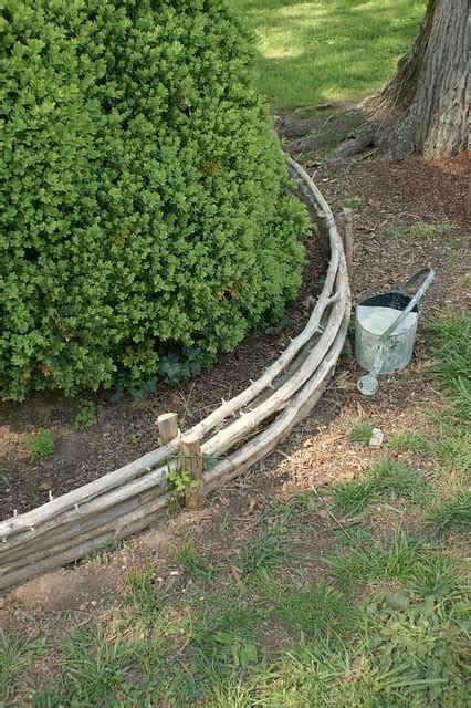 Fasten the edging to the stakes and excavate the remainder of the site. Curved cedar edging (2) | Flickr - Photo Sharing!