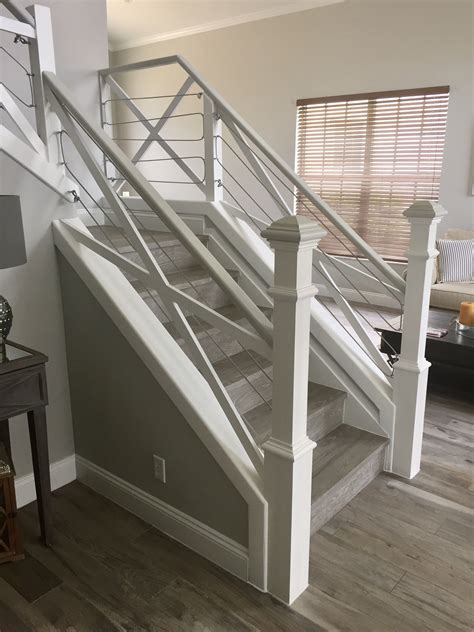 A farmhouse stair railing might not be at the top of your list when refreshing your home, but we think it should be given a higher priority. Grey and white! #rusticchic #HandRail #Rail #Cable #Stair #Staircases #House #Stairways #Remodel ...