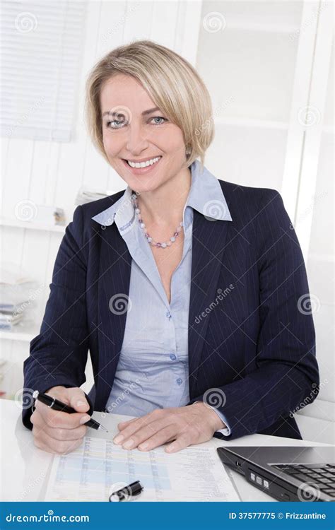 Happy Senior Female Manager Portrait In The Office Stock Image