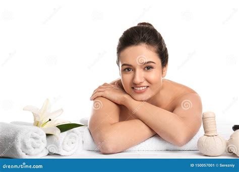 Young Woman Relaxing On Massage Table Against White Background Spa