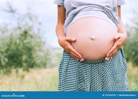 Close Up Of Pregnant Belly In Nature Stock Image Image Of Embracing Holding 107469241