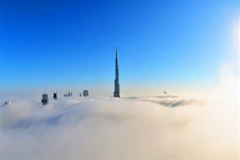 Dubais Burj Khalifa Peeks Out Of The Early Morning Fog Insight
