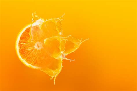 Premium Photo Fresh Half Slice Of Ripe Orange Fruit Floation With