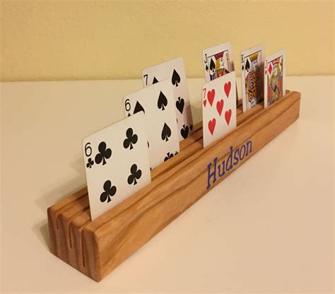 Making a beautiful money holder card is a great way to turn it into a handmade gift. Two Personalized Playing Card Holders with vinyl or engraved