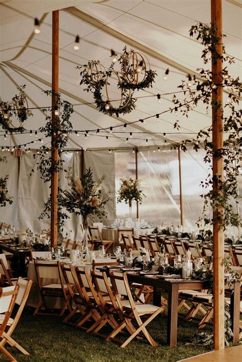 Rustic Marriage Tent With Tons Of Greenery Present Day Wedding