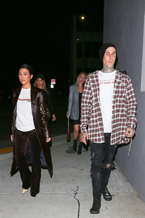 Kardashian sports long nails with red tips, while barker's tattoos are on display. Kourtney Kardashian & Travis Barker Confirm Relationship With PDA Pic - Hollywood Life