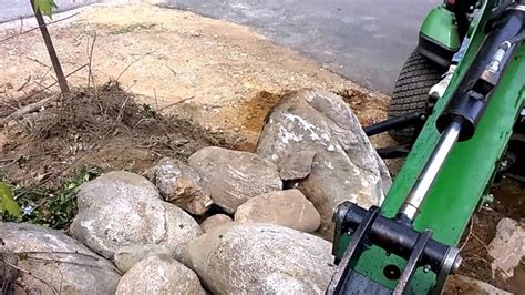 Rock Walls Using The Backhoe To Help Move Rocks Youtube