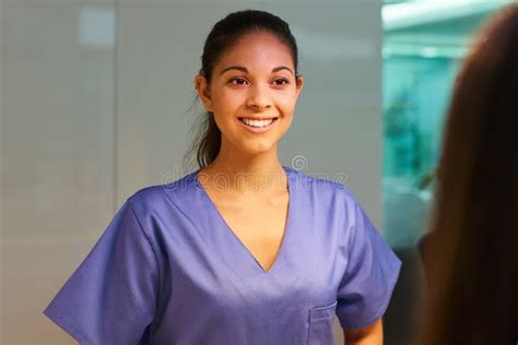 Her Friendly Face Puts Patients At Ease Rearview Shot Of A Young Nurse
