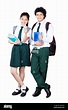 Two High-School Boy, Girl Students Holding Books And Showing Thumbs-up ...