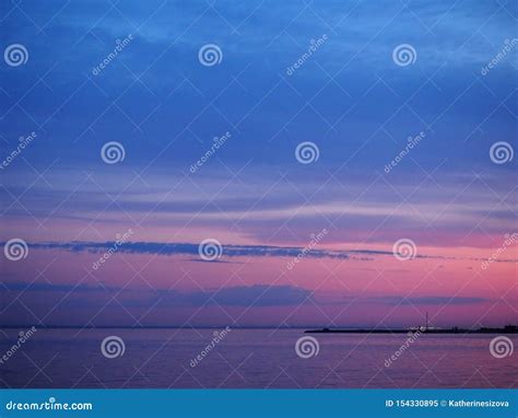 Twilight Sky At The Colorful Blue And Pink Sunset And Reflection In The