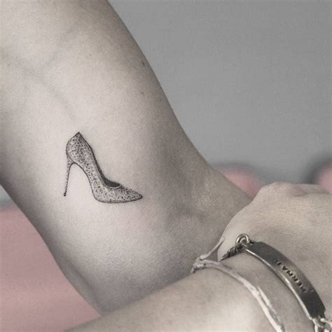 Fine Line Sparkly Shoe With A Stiletto Heel Tattoo On Heel Tattoos Shoe Tattoos Inner Arm