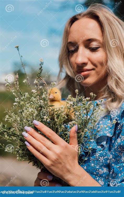 Beautiful Girl Holding Wildflowers And Duckling In Her Hands Stock Image Image Of Blue June