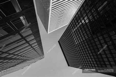 From Below Of Contemporary Skyscrapers With Glass Mirrored Walls On