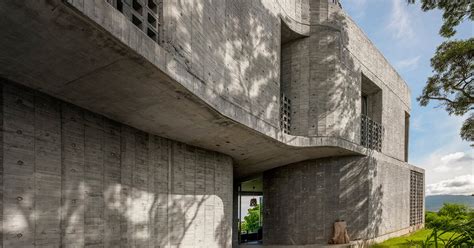 Curvaceous Concrete Walls Compose Xrange Architects Remote Retreat In