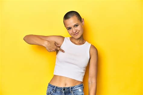 Premium Photo Shaved Head Woman Person Pointing By Hand To A Shirt