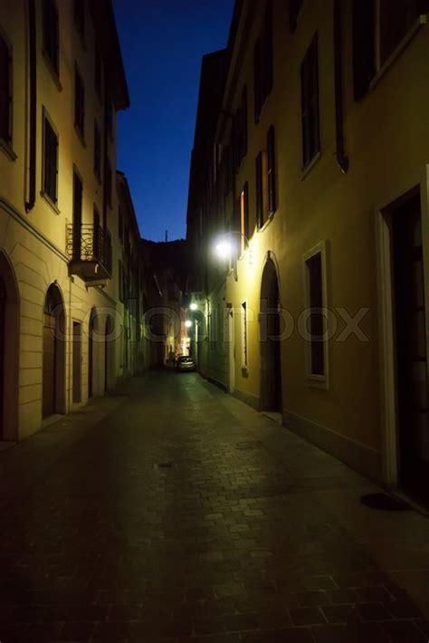 Illuminated Lonely Street With Car At Stock Image Colourbox
