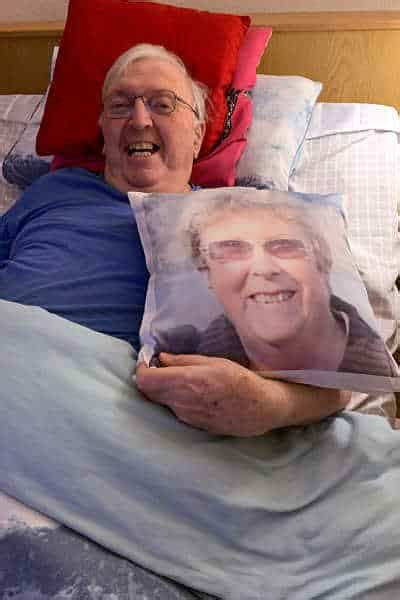 man surprised with memory pillow featuring late wife