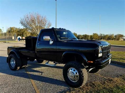 A Black Pickup Truck Parked In A Parking Lot