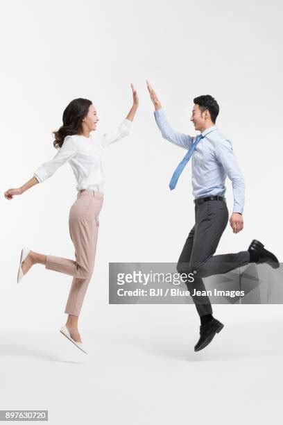 Two Men High Fiving Photos And Premium High Res Pictures Getty Images