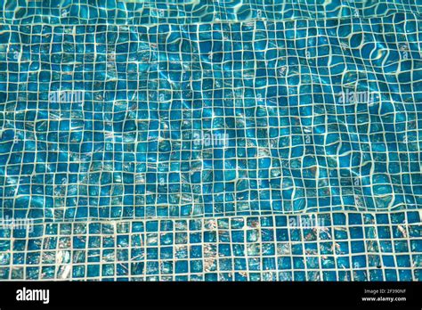 A Pool With Blue Ceramic Tiles And Water Ripple Effect Refection Of Blue Water In Swimming Pool