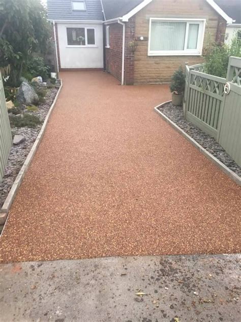 A Driveway With Gravel In Front Of A House