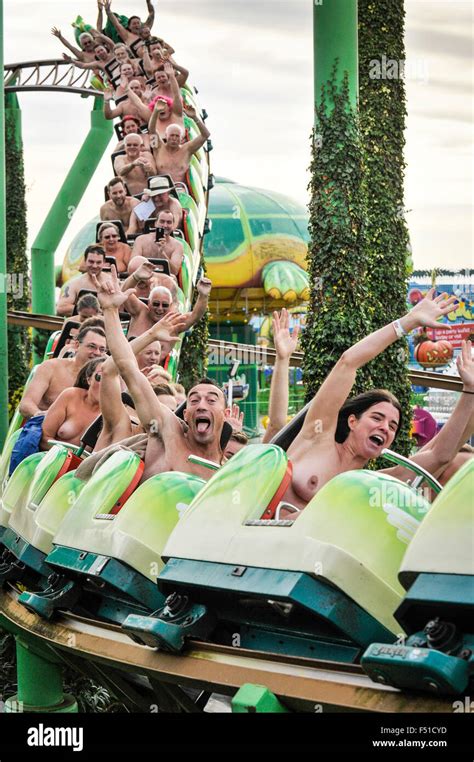 Naked Thrill Seekers Riding The Green Scream Roller Coaster On A Very