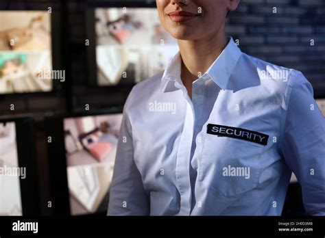 Female Security Guard Wearing Uniform At Workplace Closeup Stock Photo