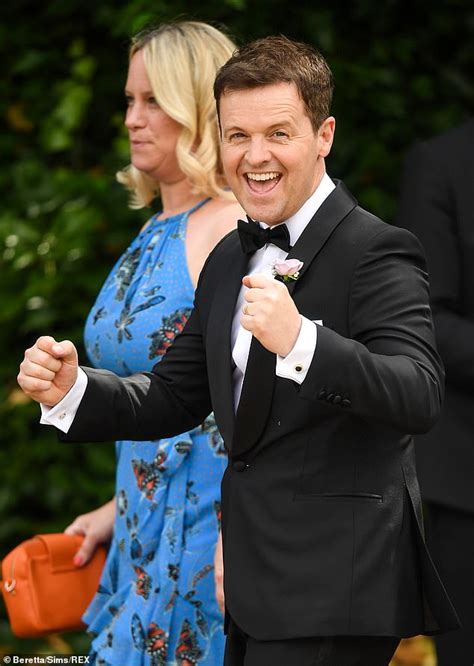 declan donnelly shakes his hands in glee following nuptials of ant mcpartlin
