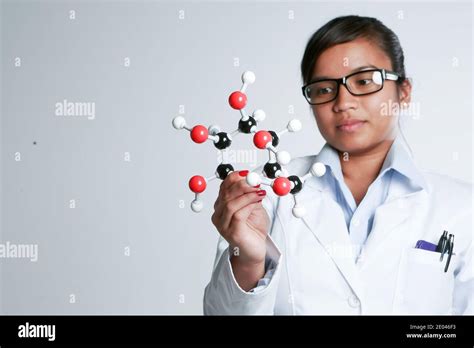 An Asian Female Medicinal Chemist Holding A Chemical Matrix Stock Photo