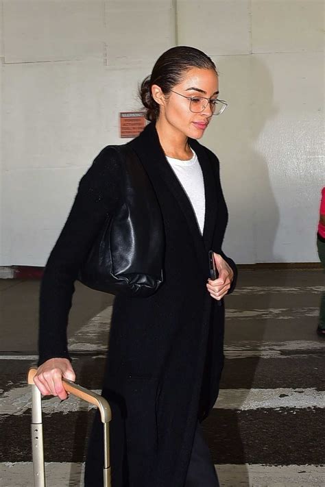Olivia Culpo Wearing Narrow Black Velvet Ankle Boots With Square Heel