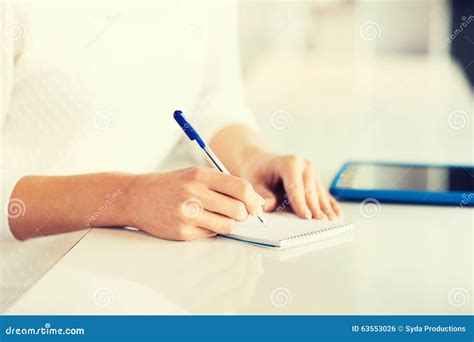 Close Up Of Hands With Pen Writing To Notepad Stock Photo Image Of