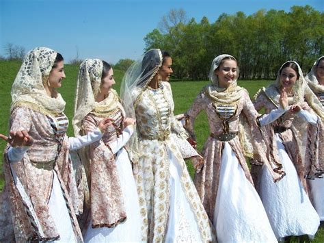 A Group Of Young Women Sporting Beautiful Pale Hued Traditional